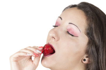 Beautiful women eating strawberry. Isolated on white