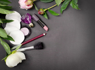 Obraz na płótnie Canvas spa and make up tools with peony flower