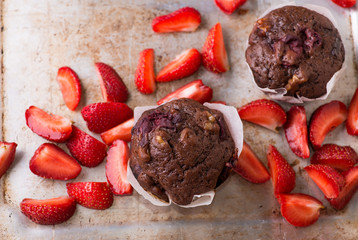 Chocolate muffins with nuts and cherry