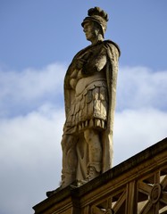 Fototapeta na wymiar Old statues from Bath and background 