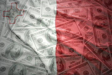 colorful waving maltese flag on a american dollar money background