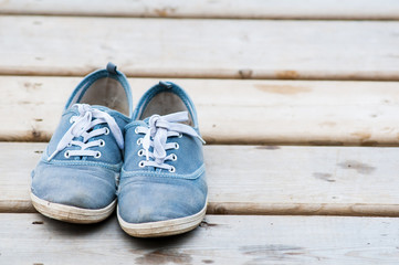 pair of old shoes on a dock