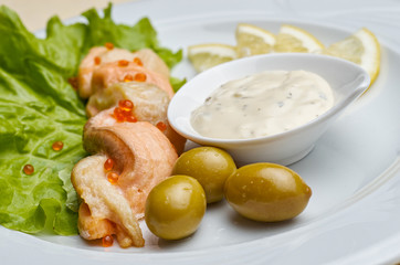 Grilled salmon and spices on stone plate over wooden table