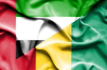 Waving flag of Guinea and United Arab Emirates