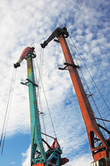 port cranes with blue sky