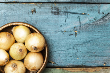 Onion on wooden table