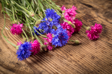 cornflowers on wooden background