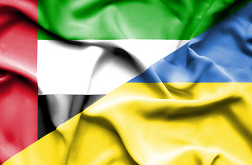 Obraz premium Waving flag of Ukraine and United Arab Emirates