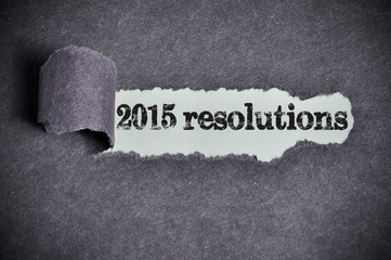 2015 resolutions word under torn black sugar paper