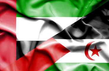 Waving flag of Western Sahara and United Arab Emirates