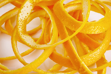 Orange peel arranged artistically shot from above cropped on a white background