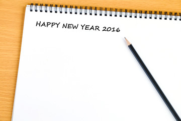 Happy new year 2016 words on blank note book background