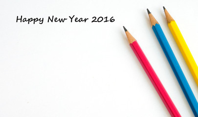 Happy new year 2016 words on white paper and pencil backgound