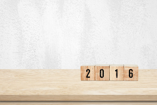Wooden cubes with 2016 on wooden table background