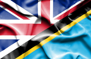 Waving flag of Tanzania and Great Britain