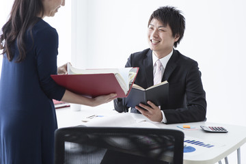 Businessman talking while watching the documents