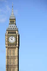 Fototapeta na wymiar Big Ben London clock tower houses of parliament isolated against a deep blue sky photo