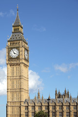 Fototapeta na wymiar Big Ben London clock tower houses of parliament building deep blue summer sky photo vertical