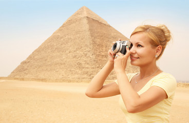 Happy Tourist and Pyramid, Cairo, Egypt. Cheerful Young Blonde 