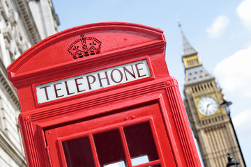 London red telephone box booth with Big Ben clock tower in the background photo