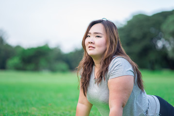 beautiful fatty woman relax in the garden