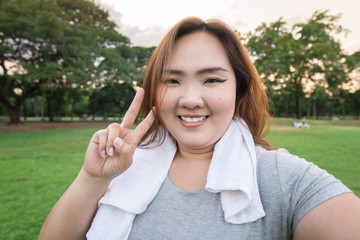 beautiful fatty woman take herself photo in the garden