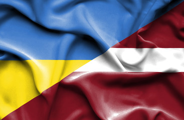 Waving flag of Latvia and Ukraine