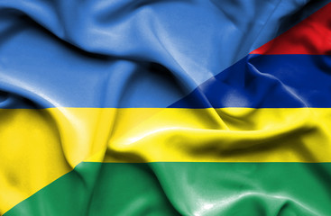 Waving flag of Mauritius and Ukraine