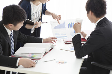 Three people have a meeting in the office