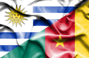 Waving flag of Cameroon and Uruguay