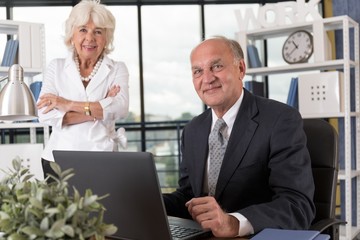 Elderly couple in bureau