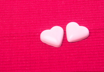 chocolate in pink colour or love shape chocolate.