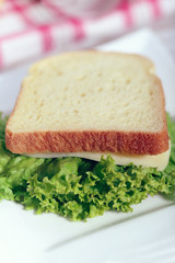Sandwich with cheese and lettuce