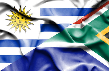 Fototapeta premium Waving flag of South Africa and Uruguay