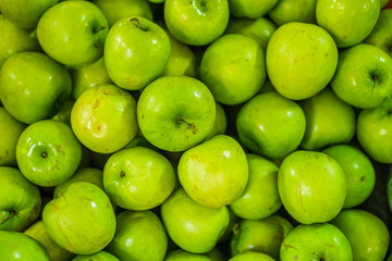 Heap of ripe Ziziphus mauritiana for retail sale in market