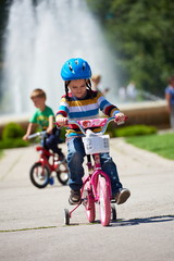 Fototapeta na wymiar happy boy learning to ride his first bike