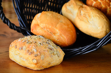 Assorted bread rolls in a wicker basket