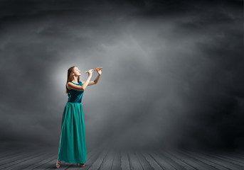 Lady playing fife