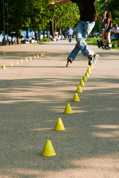 Skating Young Man On Rollerblades