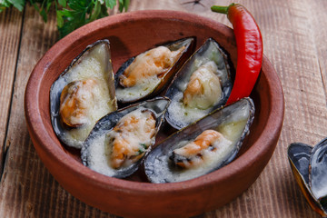 Mussels baked with cheese and lemon