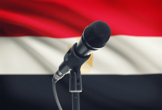Microphone on stand with national flag on background - Egypt