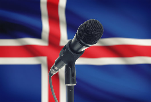 Microphone on stand with national flag on background - Iceland