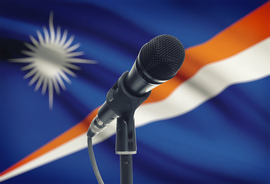 Microphone on stand with national flag on background - Marshall Islands