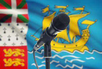 Microphone on stand with national flag on background - Saint-Pierre and Miquelon