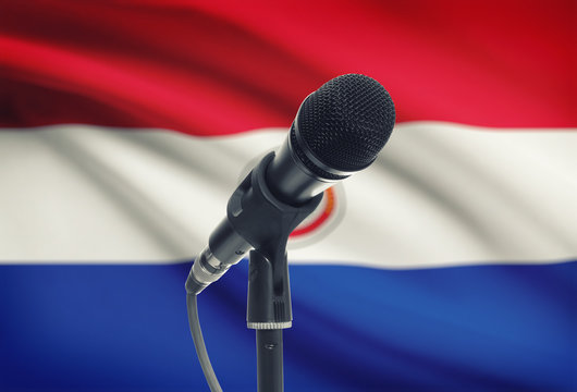 Microphone on stand with national flag on background - Paraguay