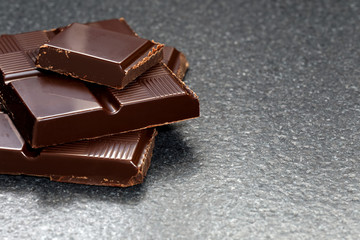 Dark chocolate on a stone table 
