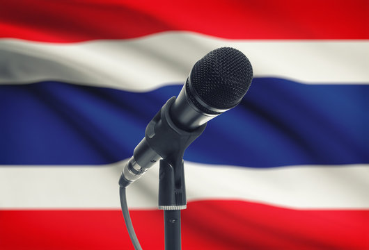 Microphone on stand with national flag on background - Thailand