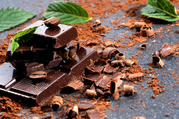 Dark chocolate and coffee bean on a stone table 
