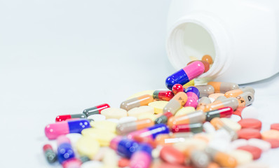 Colorful tablets, capsules in white background