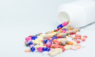 Colorful tablets, capsules in white background